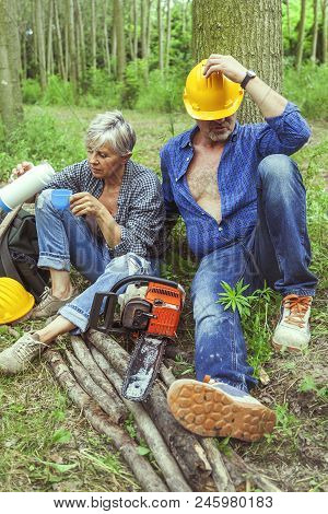 Couple Of Expert Woodsmen Taking A Break