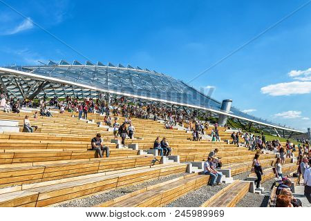 Moscow - June 16, 2018: People Visit The Modern Amphitheater With A Glass Roof In Zaryadye Park In M