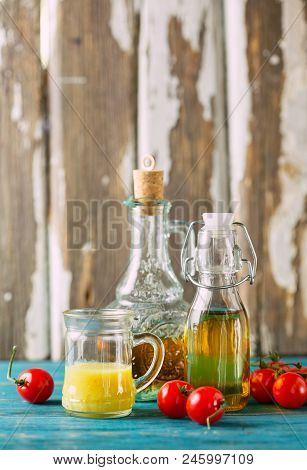 Variety Of Homemade Sauces And Salad Dressings In Jars Including Oil, Vinegar, Mustard Dressing For 