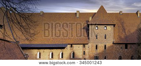 Malbork, Pomerania, Poland - January 2: Sunrise Over Castle Of The Teutonic Order In Malbork - The L