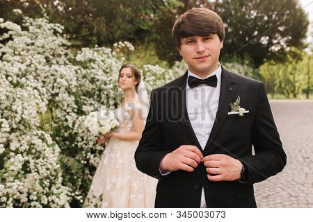 Handsome Groom Staind In Front Of Beutiful Bride