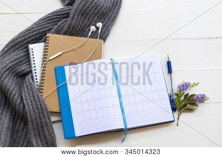 Notbook Monthly Planner  For Business Work And Knitting Wool Scarf Of Lifestyle At Office Arrangemen
