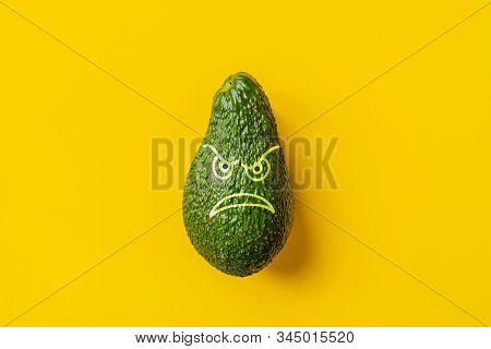 Fresh Avoado On Yellow Background Isolated Text Design B
