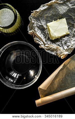 Ingredients And Utensils For Making Cookies And Cooking. Yellow Butter, Sugar In A Glass Dish On A B