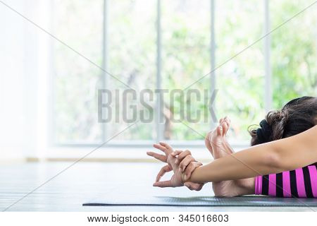 Close-up Of Asian Women Workout Practicing Yoga Training Put On Pink Clothes And Practice Meditation