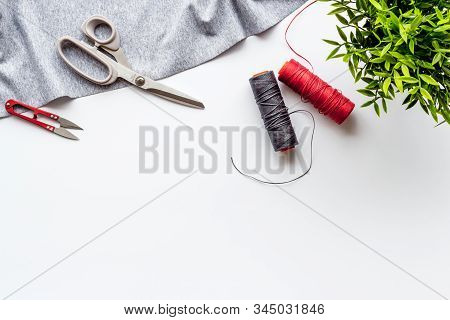 Sewing Wokrshop. Textile, Pattern, Scissors, Thread On White Background Top-down Copy Space