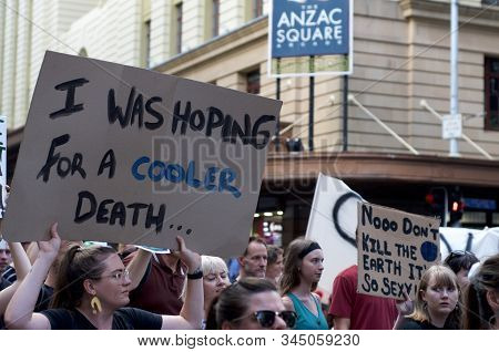 Brisbane, Queensland, Australia - 10th January 2020 : A Woman Holds A Sign Protesting Government Ina
