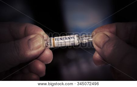 Kyiv, Ukraine-december, 2019: Injection Of Fentanyl. Glass Ampoule In A Hands Of An Old Man. Painful