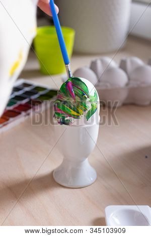 Toddler Boy Painting Easter Eggs Preparing For Holidays. Easter Tradition