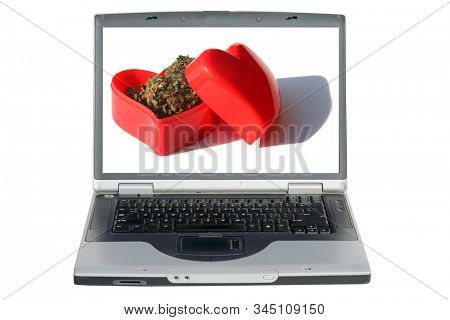 Laptop Computer. Marijuana in a Red Heart shaped box. Valentines Day Surprise Gift. Isolated on white. Room for text. Clipping Path. Be my Valentine. 