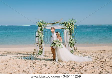 September 3, 2019. Bali, Indonesia. Wedding Ceremony At Tropical Beach. Wedding Arch And Caucasian C