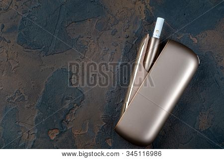 New Heat-not-burn Tobacco Heating System On Dark Background