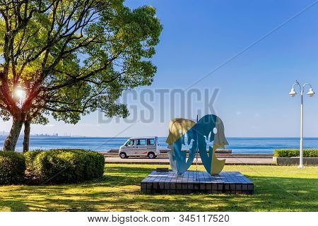 Beppu, Japan, August 5, 2017: Summer Noon On The Waterfront Of The City. Sea View From The Park. Art
