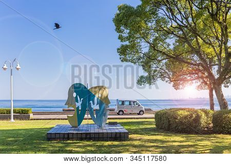 Beppu, Japan, August 5, 2017: Summer Noon On The Waterfront Of The City. Sea View From The Park.