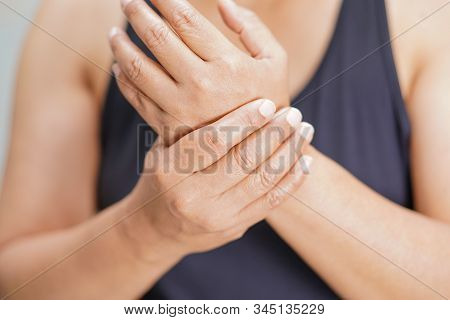 Asian Middle-aged Lady Woman Use Elastic Bandage To Treating De Quervain Syndrome At Hand And Finger