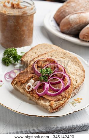 Slices Of Bread Slathered With Pork Lard Mixed With Ground Cracklings, With Onion Rings And Parsley 