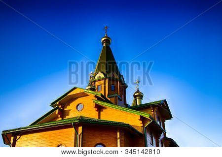 Orthodox Wooden Church At Dawn. Temple Of The Blessed Matrona Of Moscow Soligorsk