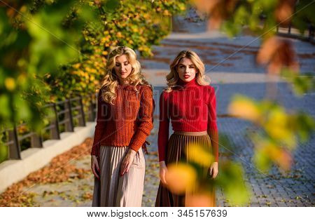 Forest Foliage. Sunny Day With Fallen Leaves. Fall Fashion Season. Pleated Trend. Girls In Corrugate