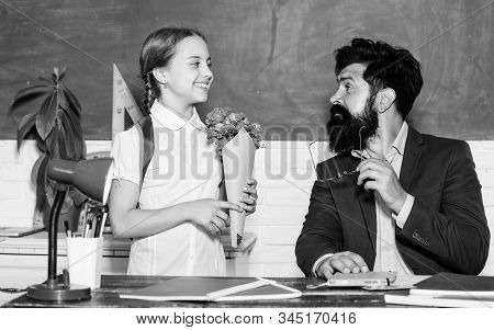 Back To School. Happy Teachers Day. Teachers Day. Daugghter And Father With Flowers. Flower Present 