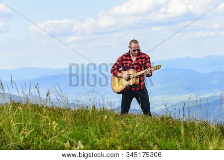 Your Favorite Radio. Western Camping And Hiking. Happy And Free. Cowboy Man With Acoustic Guitar Pla
