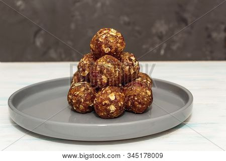 Homemade Energy Balls Like A Healthy Breakfast Or A Snack Of Raisins, Dried Apricots, Dates, Nuts An