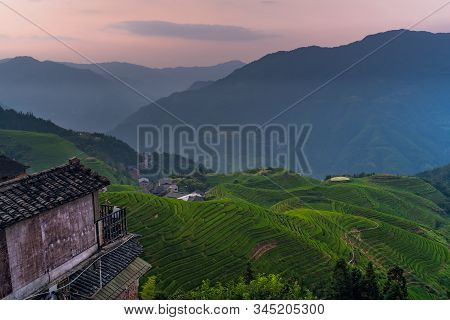 Sunset Over Seven Stars Accompany The Moon Cascading Layered Rice Terraces Forming Part Of Longji Ri