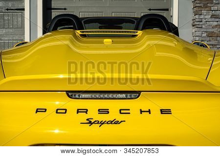Orlando, Fl/usa-1/15/20: The Rearend Of A Yellow Porsche Spyder Sitting In Front Of A Home.