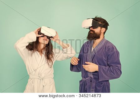 Girl And Man Hipster Relax In Bathrobe. Future Is Now. Digital Couple. Innovation In Family Relation