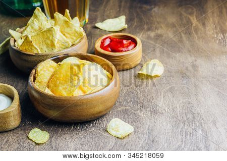 Table Fof Tasty Snacks And Beer Prepared For Watching Sports On Tv. Selective Focus