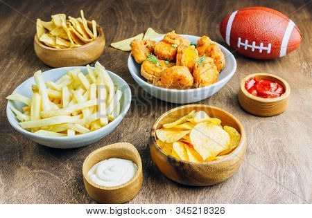 Table Fof Tasty Snacks And Beer Prepared For Watching Sports On Tv. Selective Focus