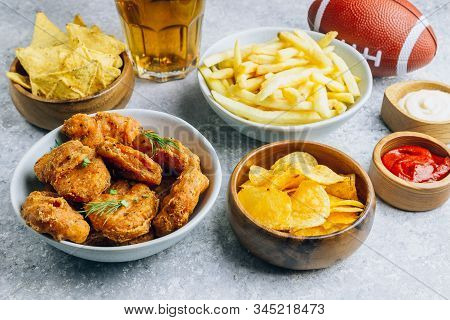 Table Fof Tasty Snacks And Beer Prepared For Watching Sports On Tv. Selective Focus