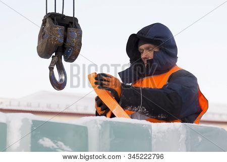 Portrait Of Installer At Unloading Ice Blocks