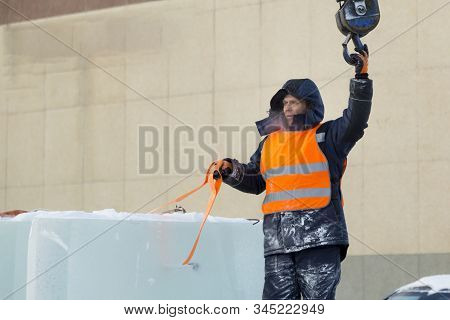 Portrait Of Installer At Unloading Ice Blocks