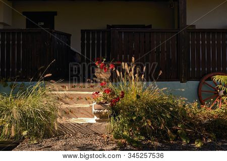 Old Style Rustic House With Laborious Wood Porch