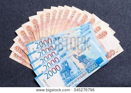 A Fan Of Five Thousandth And Two Thousandths Notes Of Russian Rubles On A Dark Background. The Conce