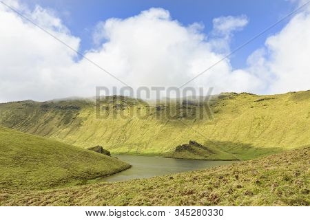 Sunlight Illuminates The Rim Of The Corvo Caldera On The Island Of Corvo In The Azores, Portugal.