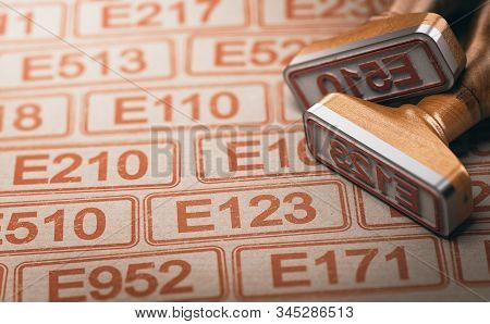3d Illustration Of Two Rubber Stamps With The Text E123 And E510 Over Other Many Controversed Number