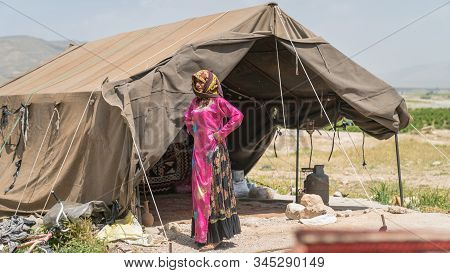Shiraz, Iran - May 2019: Qashqai Nomadic Woman By Her Tent. The Qasqhai Are Nomadic People Living In