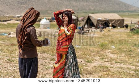 Shiraz, Iran - May 2019: Qashqai Turkish Man And Woman Talking In Their Land