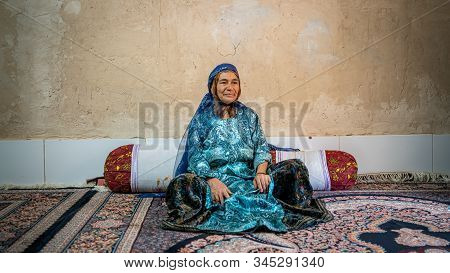 Shiraz, Iran - May 2019: Qashqai Turkish Woman Wearing A Traditional Dress In Her House