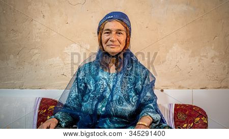 Shiraz, Iran - May 2019: Qashqai Turkish Woman Wearing A Traditional Dress In Her House
