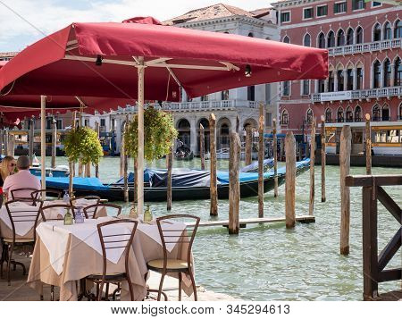 Venice Italy 08 14 2019 Guests Eat In A Restaurant In The Background Of A Gondola