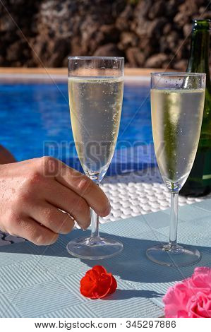 Pool Party With Two Glasses Of Bubbles White Champagne Or Cava Wine, Romantic Event On All Inclusive
