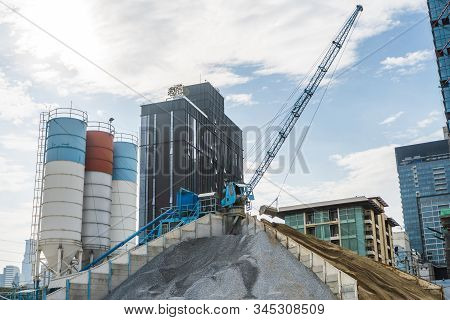 Blue Crane On A Modern Construction Site. Construction Crane On A Constructin Site. Crane Machine St