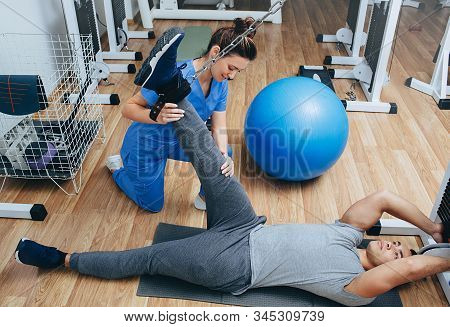 Kinesitherapist Treats Athletes Foot Injuries After Hard Training. Knee Pain. Kinesitherapy