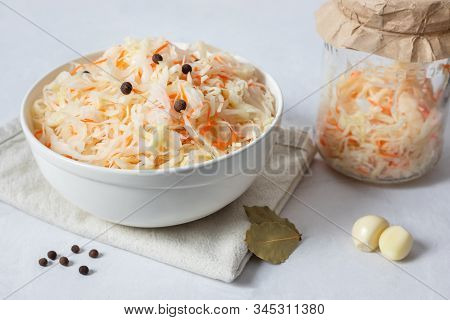 Homemade Sauerkraut. Fermented Food. Sauerkraut With Carrots In A White Bowl On A White Background C