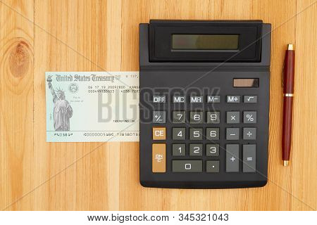 United States Treasury Check For Either A Federal Tax Refund Or Social Security Payment With A Calcu