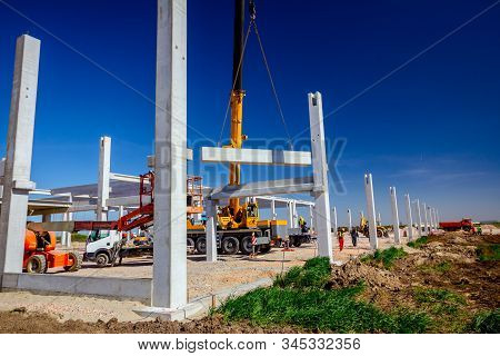 Zrenjanin, Vojvodina, Serbia - April 20, 2018: Mobile Crane Is Operating And Worker Is Assembly Conc
