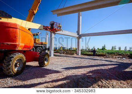 Zrenjanin, Vojvodina, Serbia - April 20, 2018: Mobile Crane Is Operating And Worker Is Assembly Conc