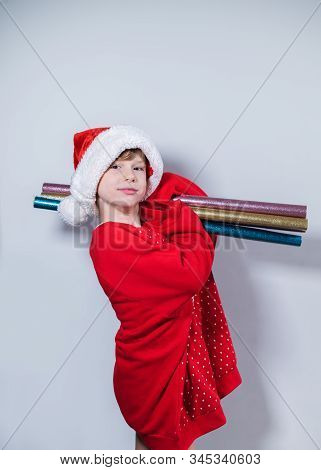 Charming Boy Wearing Santa's Hat In Red Sweater